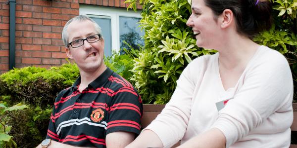 Resident and staff member at Cheshire House Inverness
