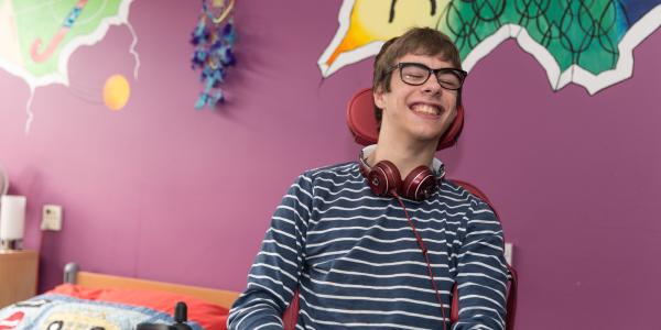 Resident in bedroom at No.1 Lavender Fields