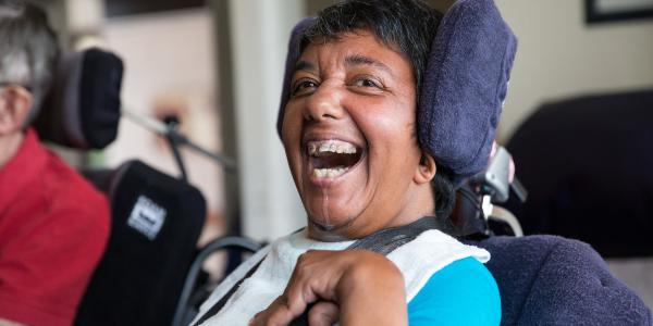 Close up of a resident laughing at the camera