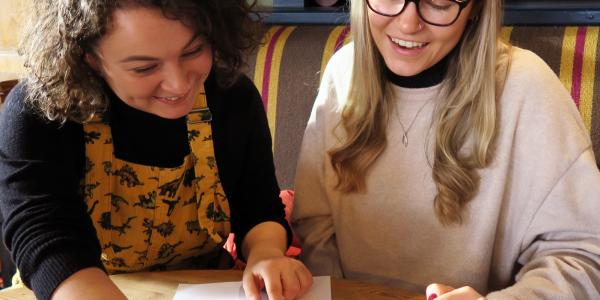 Two women taking part in a quiz