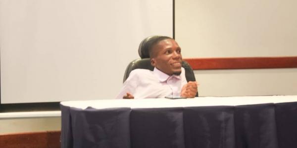 Ian Banda speaking at a conference