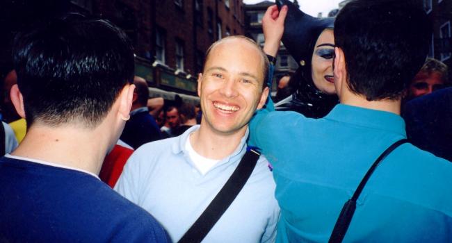 Kieran amongst a group of people at a Pride event