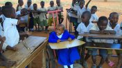 Avina Amos in the classroom surrounded by other children