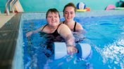 Gloucestershire House resident with occupational therapist in the hydrotherapy pool