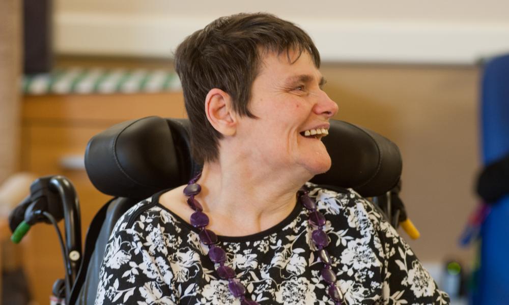 Resident playing dominoes at Dolywern