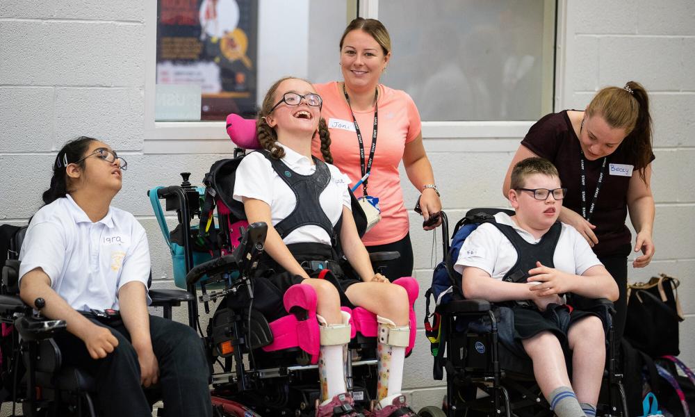 Young people in wheelchairs at a group event