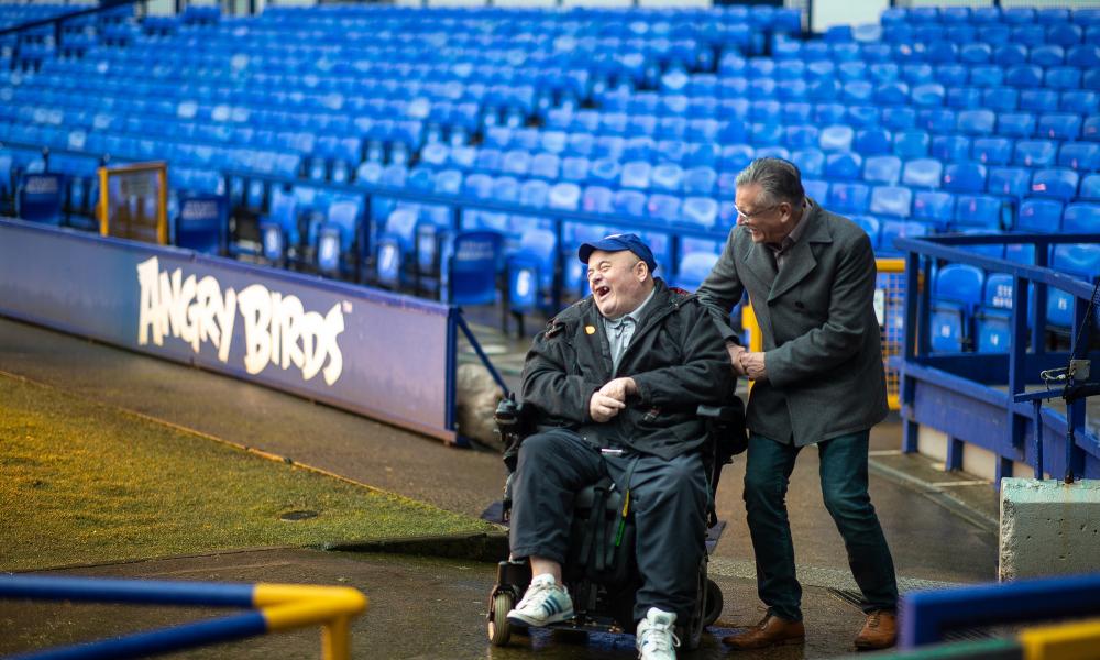 Graham, a volunteer, with Eddie at Goodison Park, home of Everton Football Club