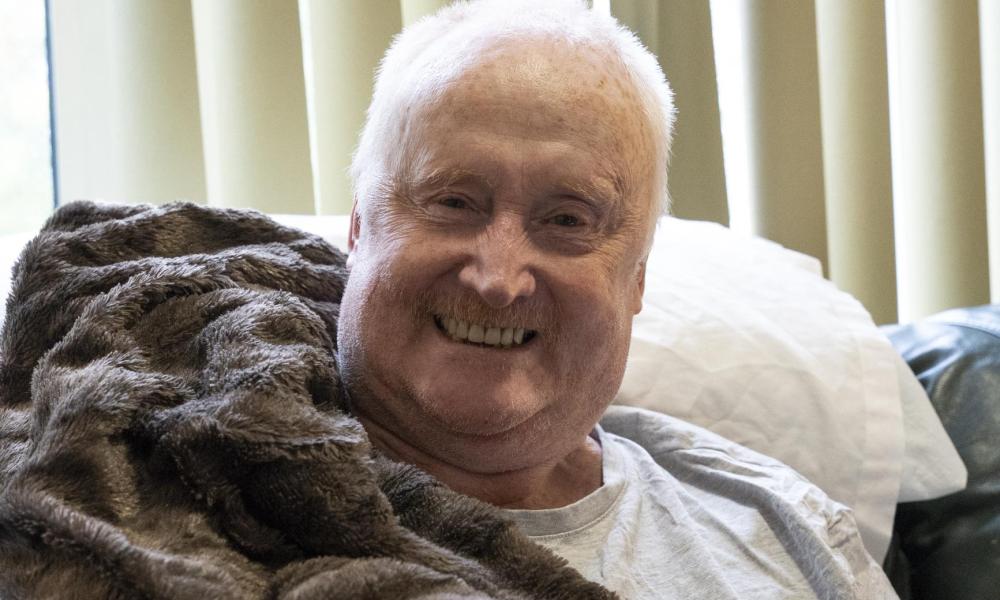 Paul smiling in his supported living flat