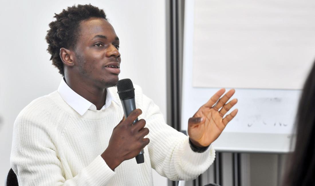 Samson speaking into a microphone